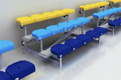 Movable aluminum alloy bleachers with blue and yellow cushioned seats, portable grandstand seating system for events & sports venues