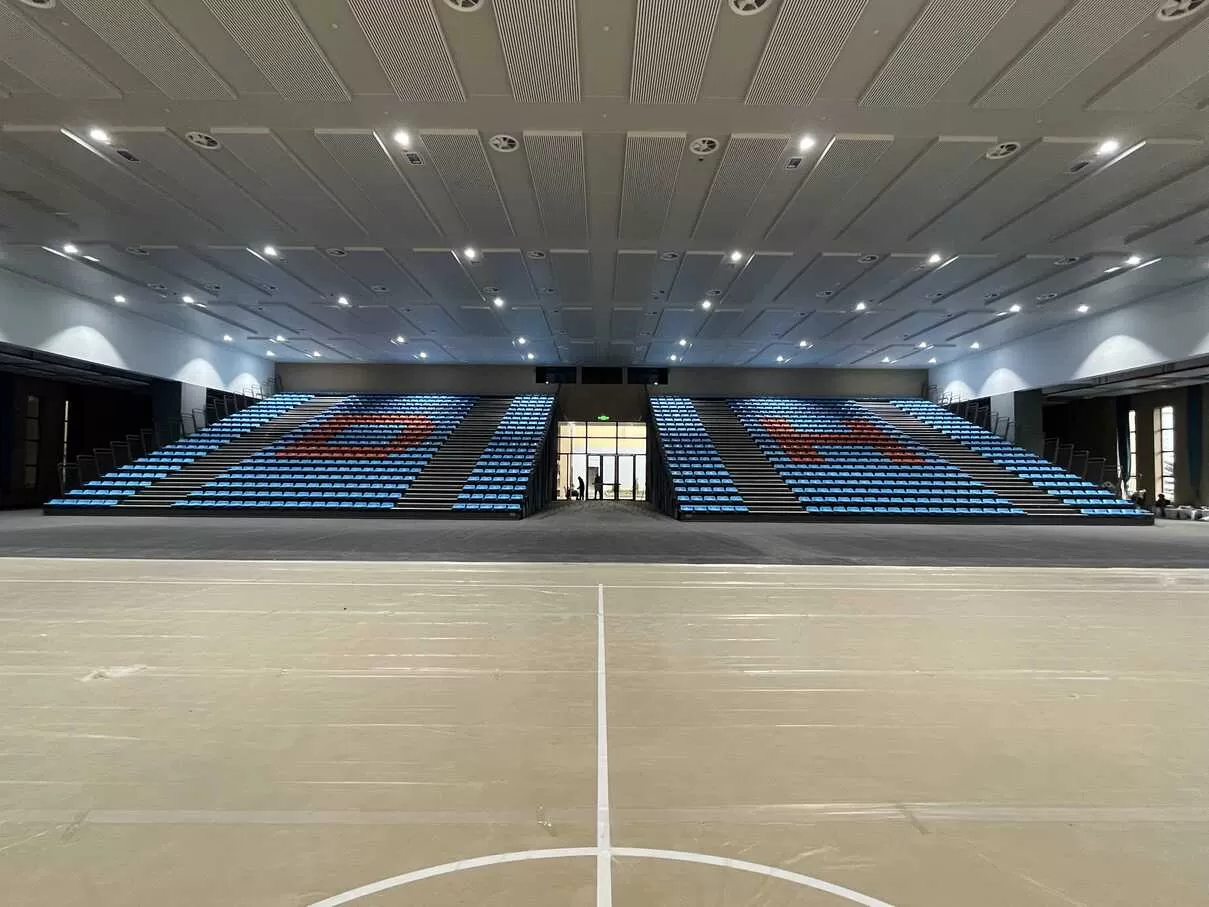 Telescopic seating system installation at Donghua Middle School Gymnasium | China telescopic bleachers supplie